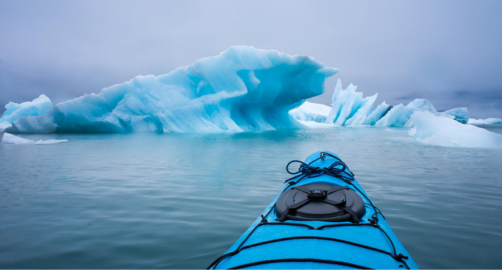 Kayaking Near An Iceberg